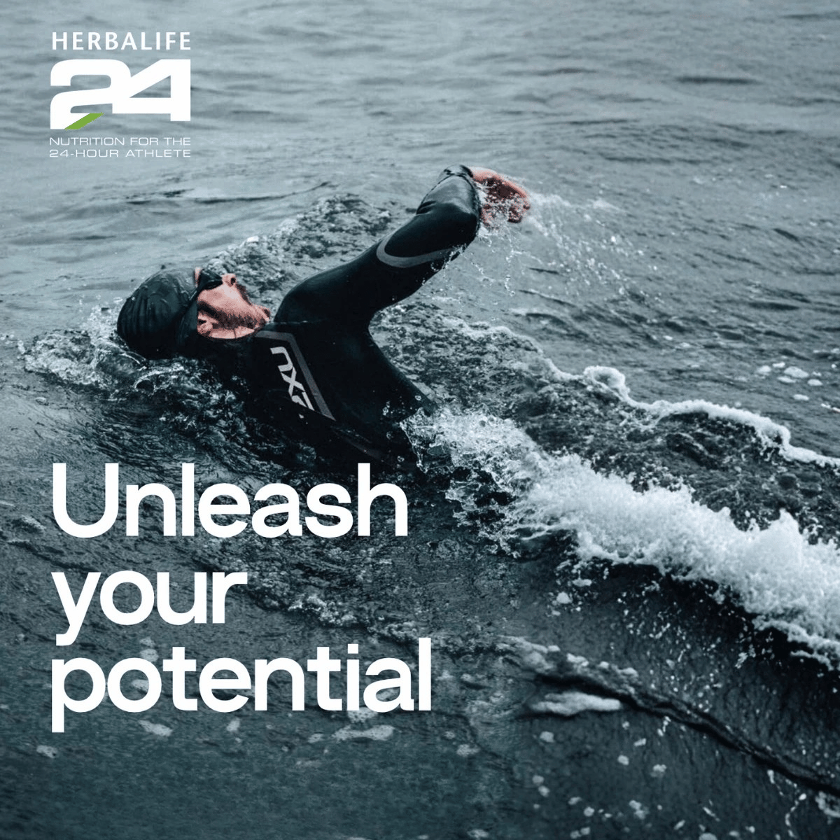 Person in a wetsuit swimming in water with Herbalife24 branding and 'Unleash your potential' text.
